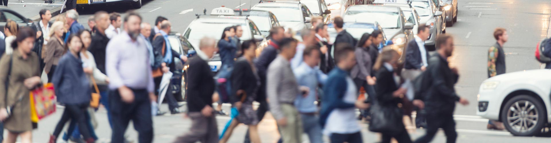 Pedestrians crossing the road on busy Sydney street