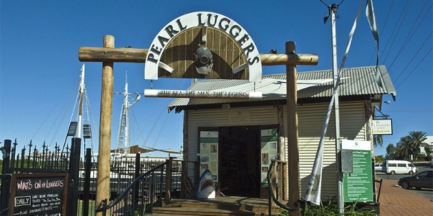 pearl luggers museum and sign featuring a vintage diving helmet viewed from the front